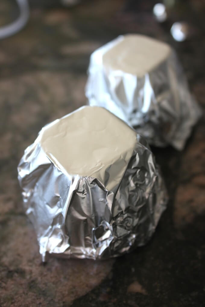 Tin foil covered egg carton cup for bell ornament