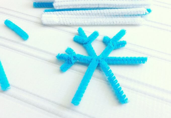 Making pipe cleaner snowflakes