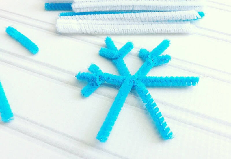 Making pipe cleaner snowflakes