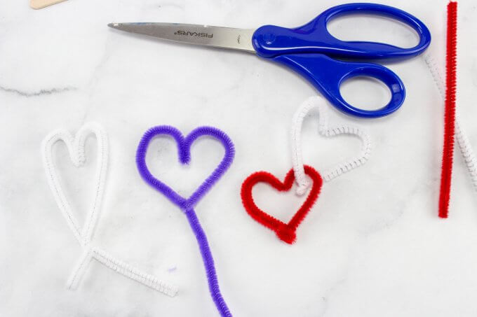 making hearts with pipe cleaners to add to mason jar