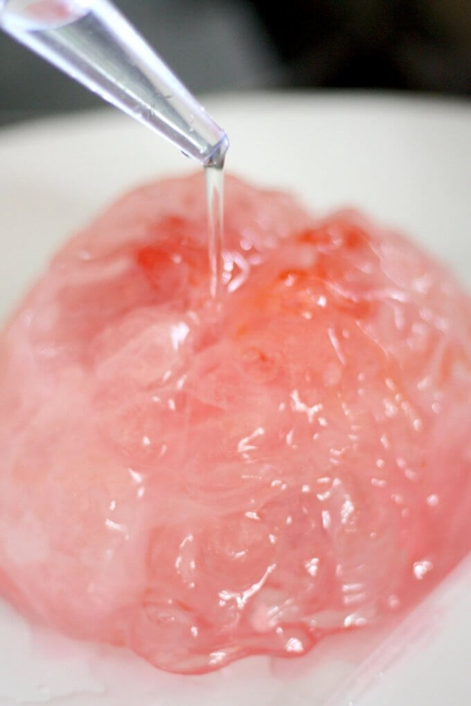 Melting frankenstein's frozen brain Halloween science activity with warm water and a baster