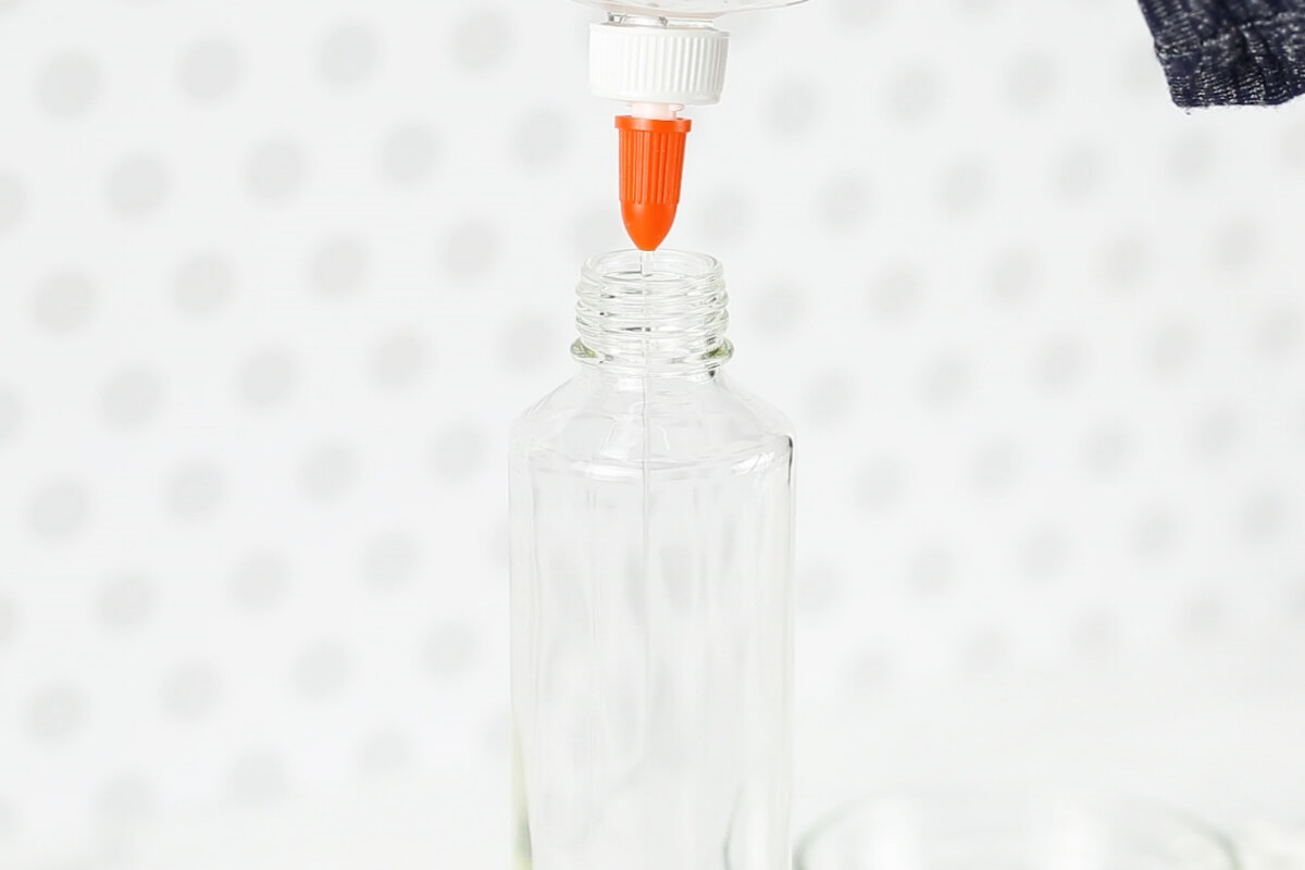 Squeezing glue into Voss bottle for winter sensory bottle