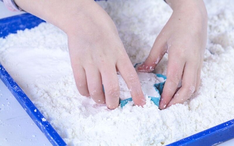 Make fake snow and use cookie cutters for play ideas 