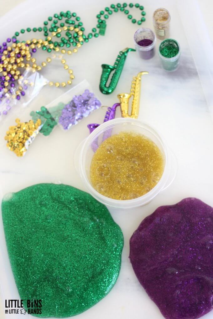 Mardi Gras slime recipe set up and accessories for making colorful Mardi Gras slime for science and sensory play