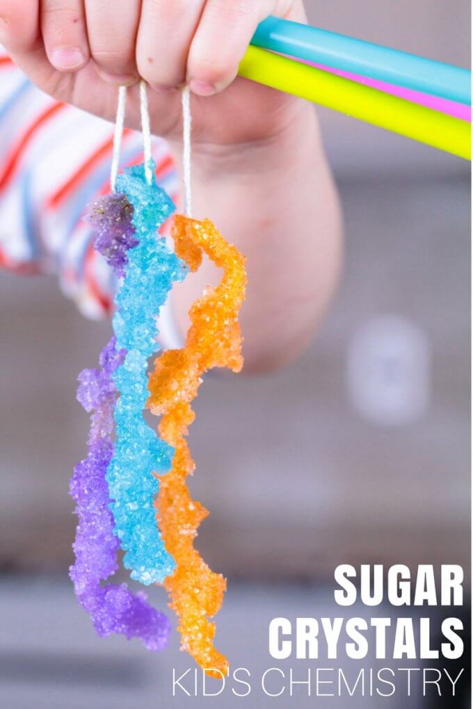 Absolutely sweet science! Grow sugar crystals and make homemade rock candy with this kitchen chemistry experiment the kids will love! Are your kids always in the kitchen looking for a snack? How about next time they are looking for a sweet treat, you add some fun learning to their snack request! Growing sugar crystals is fun chemistry experiment for kitchen science. 