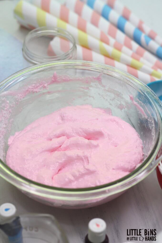 fluffy pink cotton candy slime in bowl on table