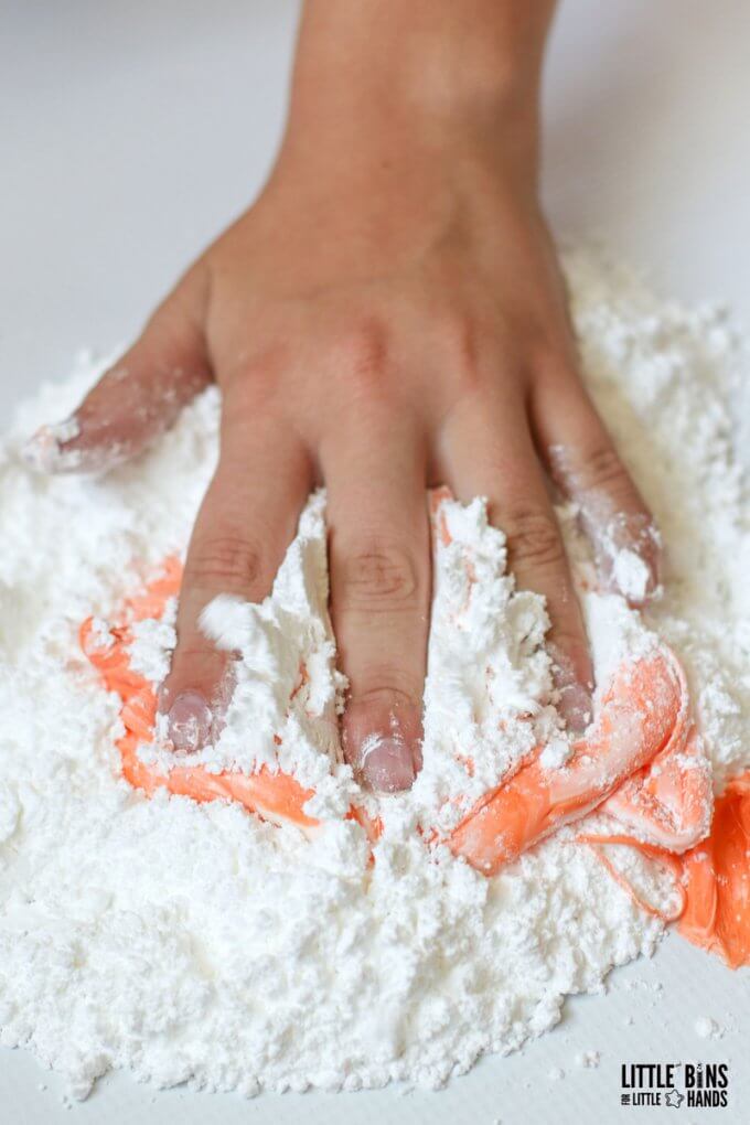 working powdered sugar into melted taffy candy for edible slime recipe using taffy