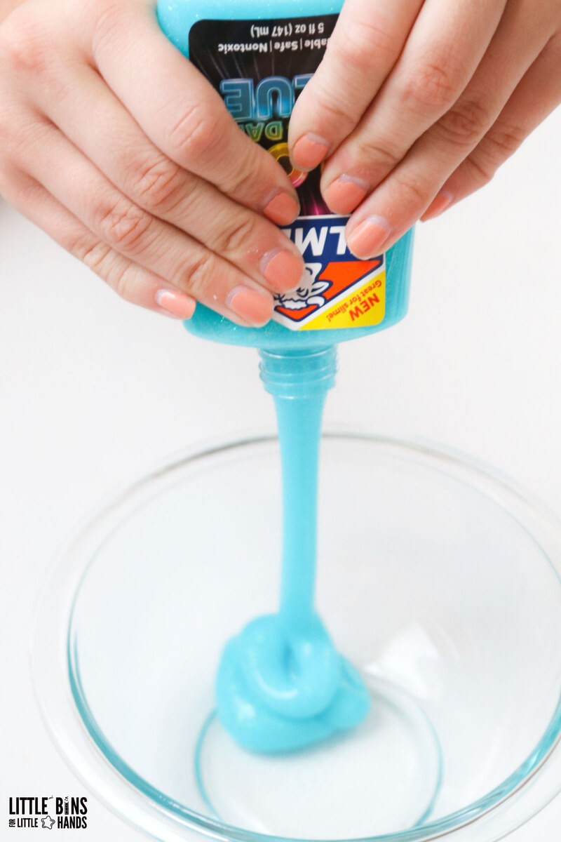 Elmers slime -squeezing elmers glow in the dark glue into bowl