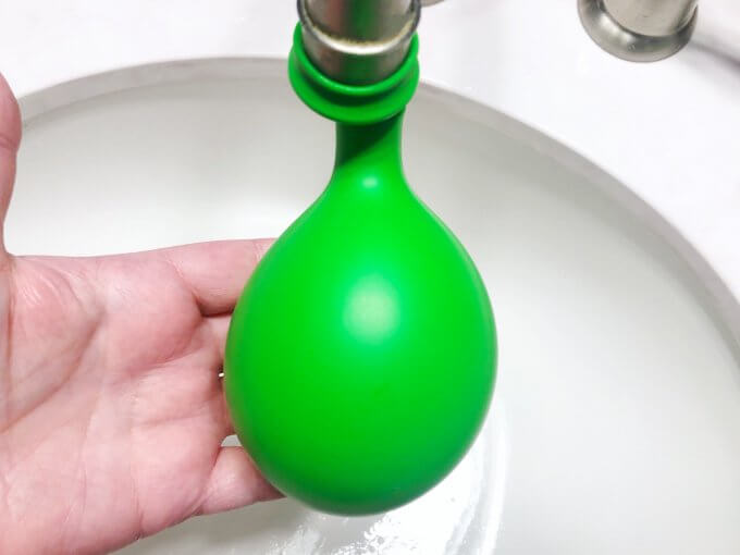 half fill a balloon with water