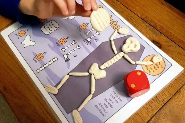 Roll a Skeleton Printable Halloween Game - Little Bins for Little Hands
