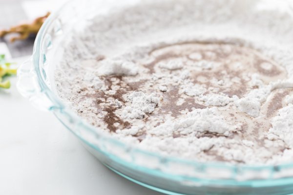 Adding water to cornstarch and coffee grounds