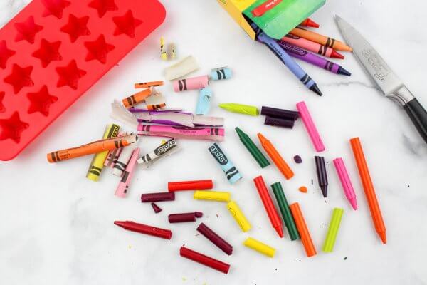 peel off paper and break up crayons to make DIY crayons
