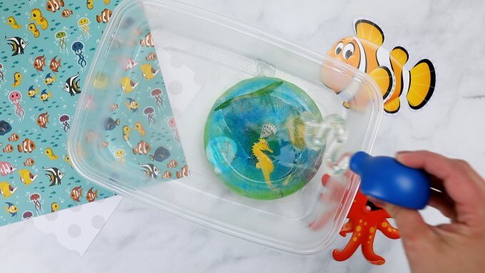ocean themed sensory bin with ice