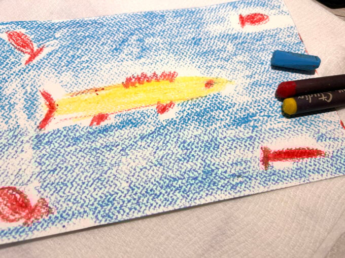 drawing fish with oil pastels on paper for a Paul Klee goldfish art project