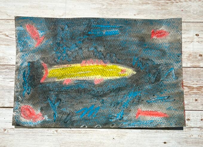 Paul Klee goldfish art project with glowing fish on dark background
