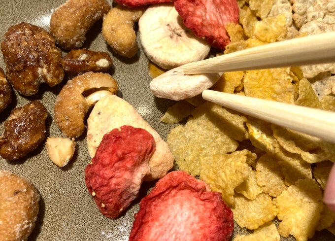 kids testing bird beaks with different foods and chopsticks 
