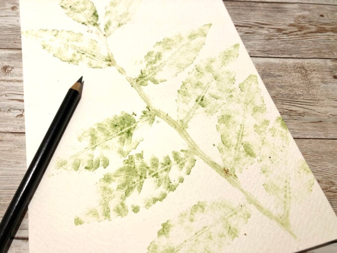 Colorful leaf and flower hammer prints made with natural plant pigments