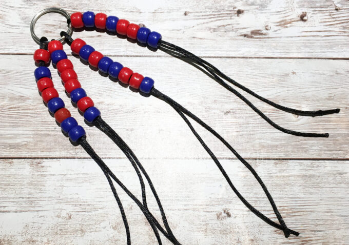 threaded binary code beads attached to keychain